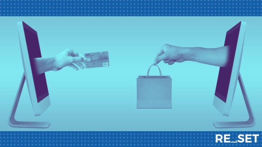 Hands reaching out from a screen to make a retail purchase